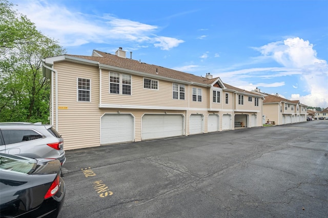 2816 Whispering Hls, Chester, NY 10918 - rear view of house featuring a chimney and a residential view