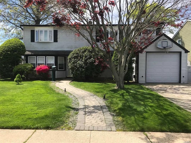 traditional-style house featuring a detached garage, driveway, an outdoor structure, and a front yard