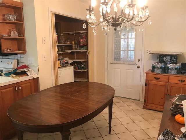 dining room featuring a chandelier and light tile patterned floors