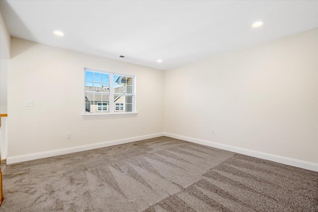 carpeted spare room with baseboards and recessed lighting