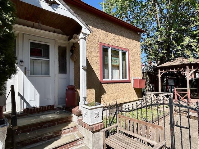 43-51 166th St, Flushing, NY 11358 - view of home's exterior featuring a gazebo and stucco siding