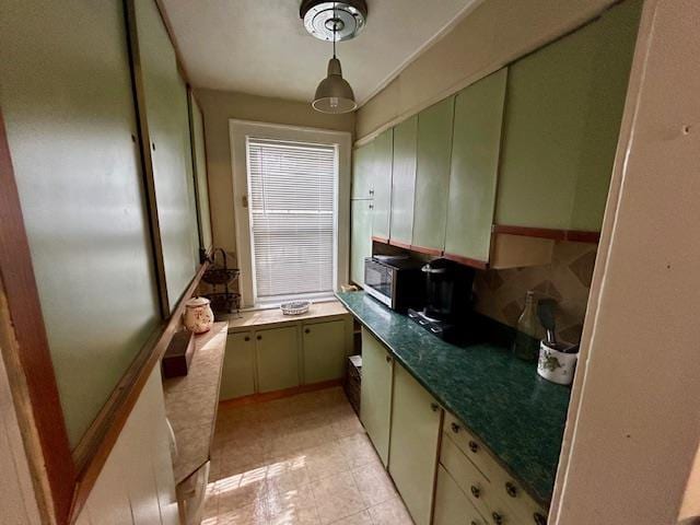 43-51 166th St, Flushing, NY 11358 - kitchen featuring dark countertops and stainless steel microwave