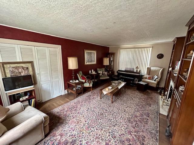 43-51 166th St, Flushing, NY 11358 - living area featuring a textured ceiling, baseboards, and wood finished floors
