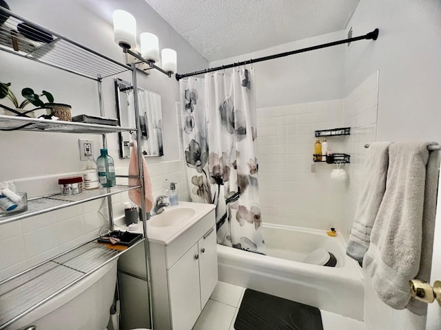 39-60 54th St Unit 7U, Woodside, NY 11377 - full bath featuring shower / tub combo, tile patterned floors, a textured ceiling, tile walls, and vanity