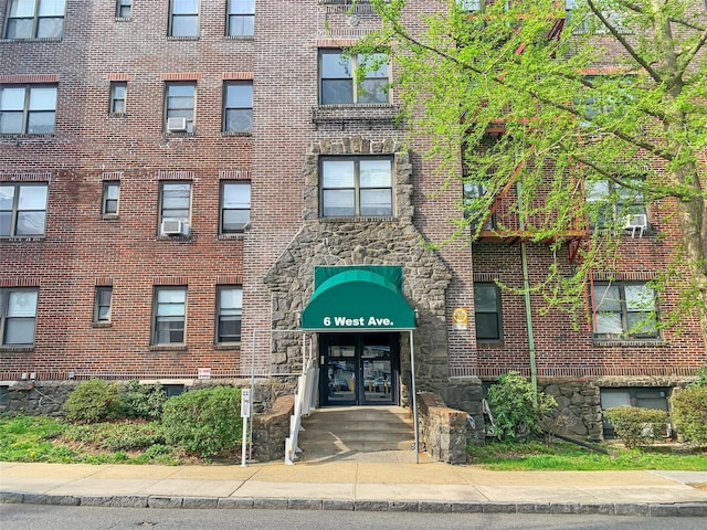view of building exterior with cooling unit