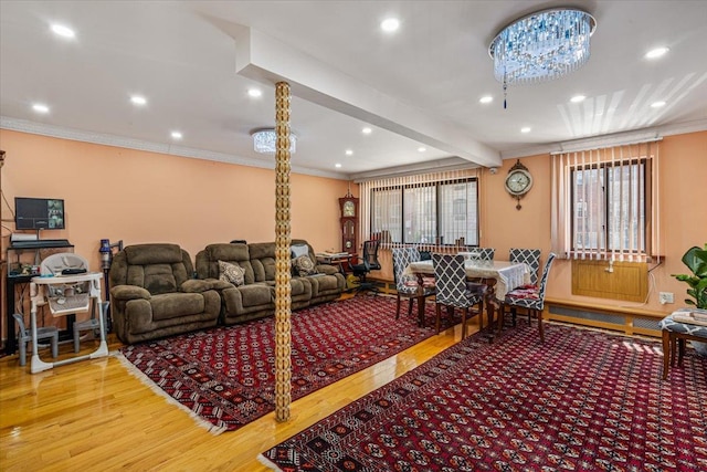living room featuring crown molding, recessed lighting, and wood finished floors