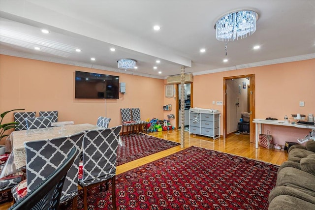 living area featuring ornamental molding, recessed lighting, and wood finished floors