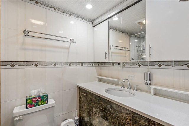 bathroom with walk in shower, toilet, vanity, and recessed lighting