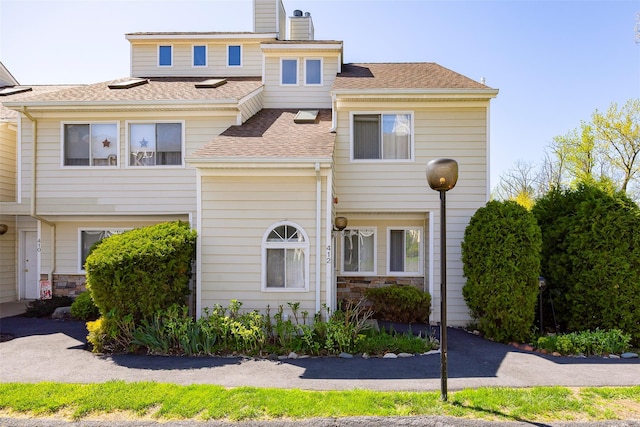412 Crystal Hill Ln, Poughkeepsie, NY 12603 - view of property featuring roof with shingles, a chimney, and stone siding