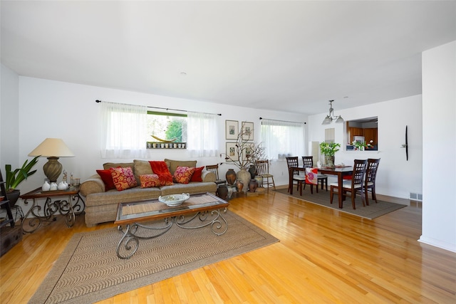 412 Crystal Hill Ln, Poughkeepsie, NY 12603 - living room with light wood-type flooring, visible vents, and a wealth of natural light