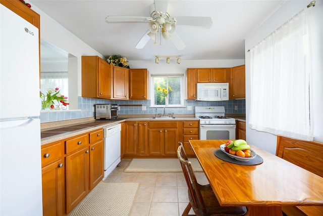 412 Crystal Hill Ln, Poughkeepsie, NY 12603 - kitchen with a sink, white appliances, light countertops, a ceiling fan, and backsplash