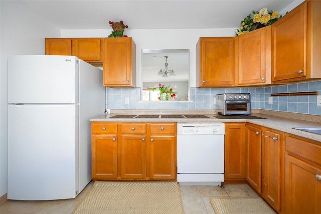 412 Crystal Hill Ln, Poughkeepsie, NY 12603 - kitchen featuring light tile patterned floors, backsplash, white appliances, and a toaster