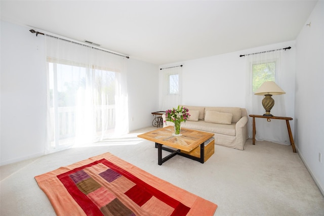 412 Crystal Hill Ln, Poughkeepsie, NY 12603 - living area with a healthy amount of sunlight, carpet, and visible vents
