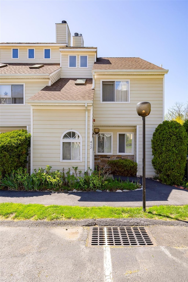 412 Crystal Hill Ln, Poughkeepsie, NY 12603 - view of property with a chimney and roof with shingles