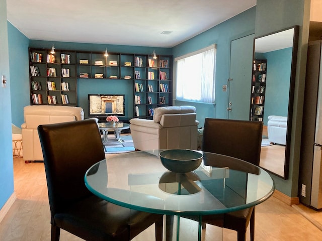 sitting room featuring baseboards and wood finished floors