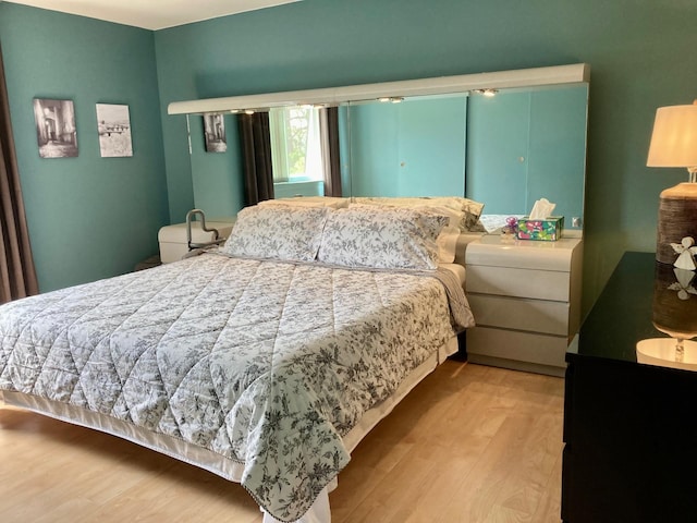 bedroom featuring wood finished floors