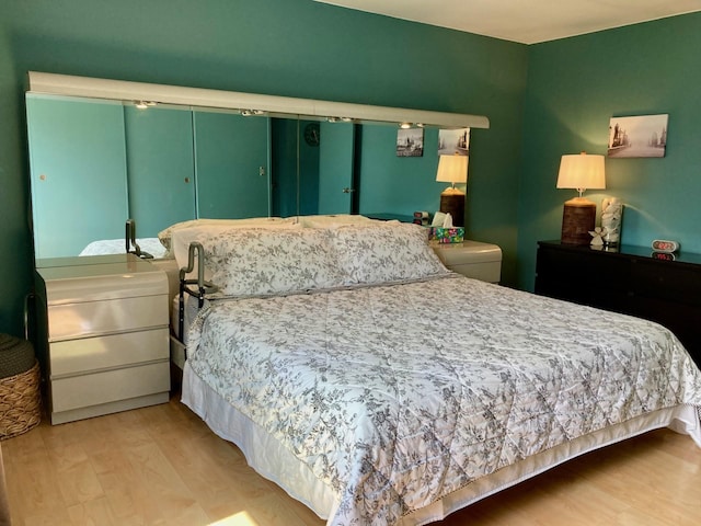bedroom with wood finished floors