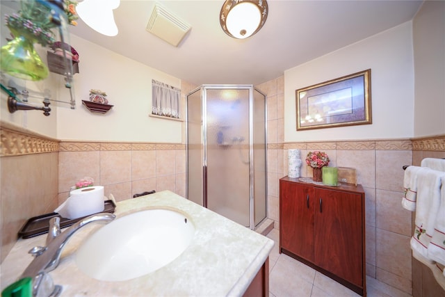 1464 W 5th St, Brooklyn, NY 11204 - full bath with tile walls, a shower stall, a wainscoted wall, vanity, and tile patterned flooring