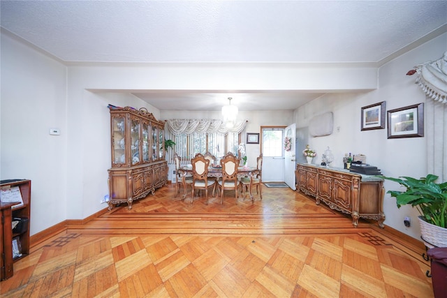 1464 W 5th St, Brooklyn, NY 11204 - dining space featuring baseboards and a chandelier