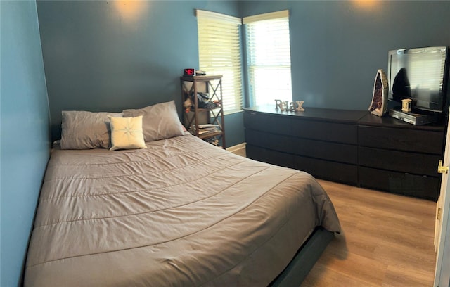 bedroom with wood finished floors