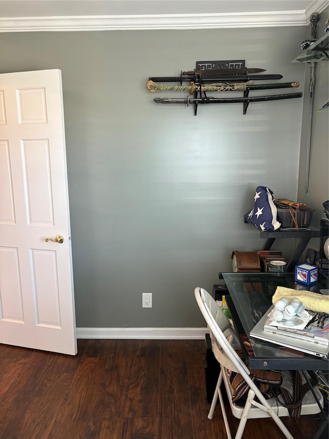 interior space featuring crown molding, baseboards, and dark wood-type flooring