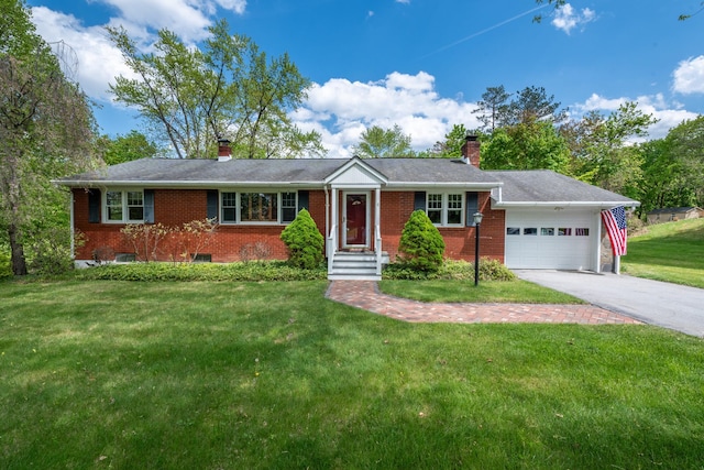 11 Mcintosh Dr, Poughkeepsie, NY 12603 - ranch-style home with a chimney, brick siding, and an attached garage