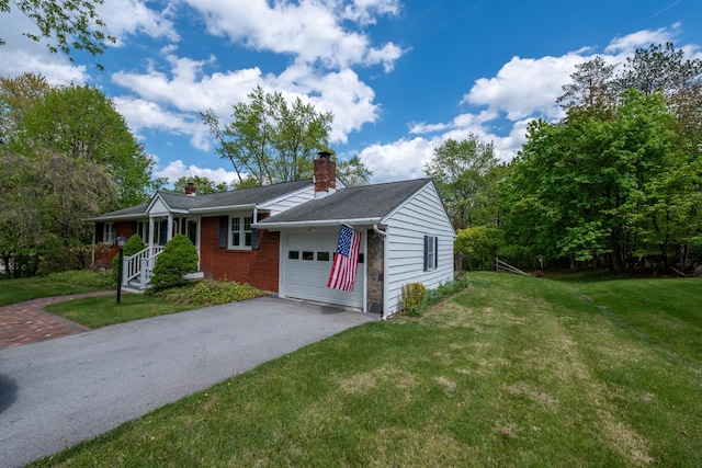 11 Mcintosh Dr, Poughkeepsie, NY 12603 - single story home with a chimney, a front lawn, aphalt driveway, and an attached garage