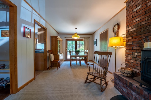 11 Mcintosh Dr, Poughkeepsie, NY 12603 - living area featuring baseboards, ornamental molding, a wood stove, and carpet floors