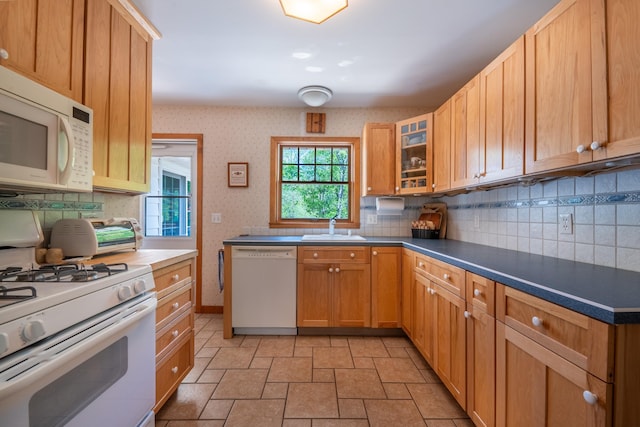 11 Mcintosh Dr, Poughkeepsie, NY 12603 - kitchen featuring white appliances, decorative backsplash, and a sink