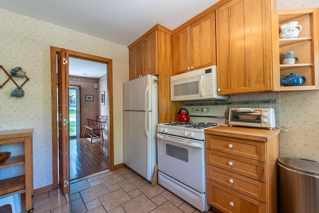 11 Mcintosh Dr, Poughkeepsie, NY 12603 - kitchen featuring white appliances, baseboards, wallpapered walls, and wooden counters