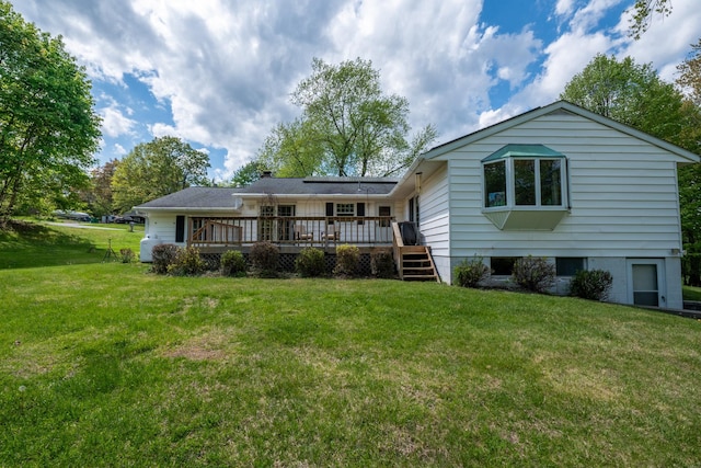 11 Mcintosh Dr, Poughkeepsie, NY 12603 - back of property featuring a yard, a deck, and a chimney