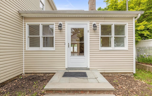 8 Maple St, Glenwood Landing, NY 11547 - doorway to property with a chimney