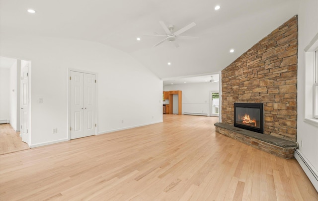 8 Maple St, Glenwood Landing, NY 11547 - unfurnished living room with a baseboard heating unit, lofted ceiling, ceiling fan, a fireplace, and light wood-type flooring