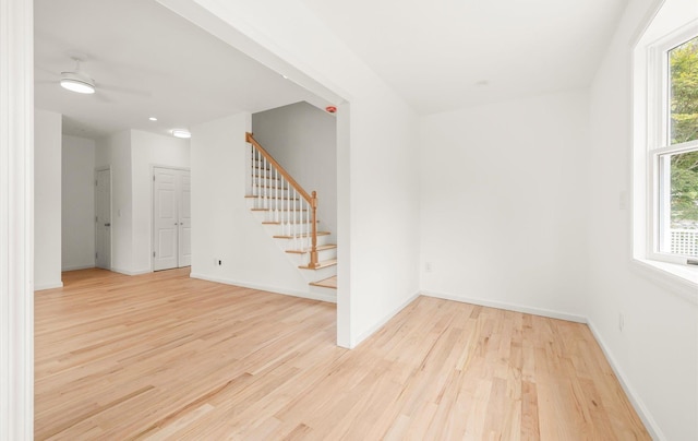 8 Maple St, Glenwood Landing, NY 11547 - spare room featuring light wood finished floors, stairs, and baseboards