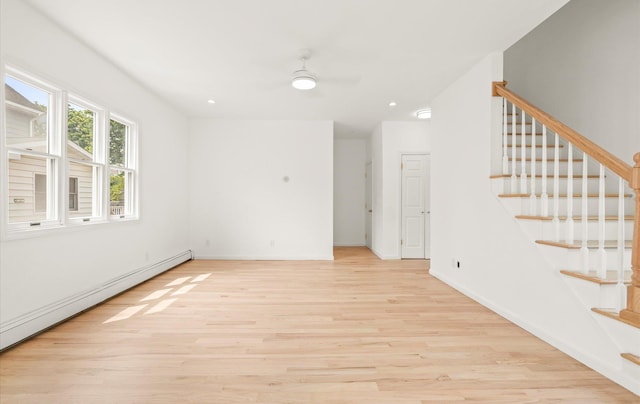 8 Maple St, Glenwood Landing, NY 11547 - unfurnished room featuring a baseboard radiator, light wood finished floors, stairway, ceiling fan, and recessed lighting