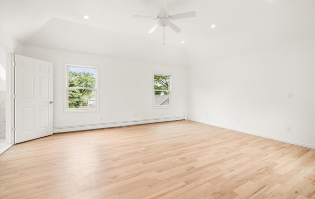 8 Maple St, Glenwood Landing, NY 11547 - empty room featuring light wood-style floors, plenty of natural light, a baseboard radiator, recessed lighting, and vaulted ceiling