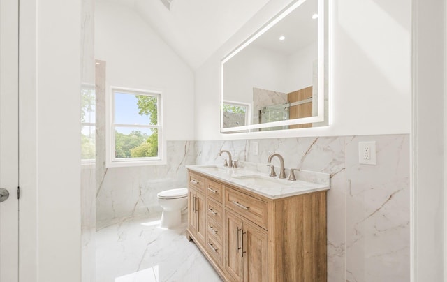 8 Maple St, Glenwood Landing, NY 11547 - full bathroom featuring tile walls, marble tiled floors, double vanity, toilet, and wainscoting
