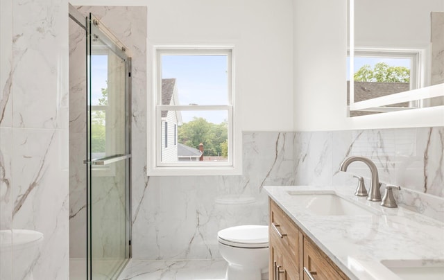 8 Maple St, Glenwood Landing, NY 11547 - full bath with tile walls, toilet, double vanity, a marble finish shower, and wainscoting