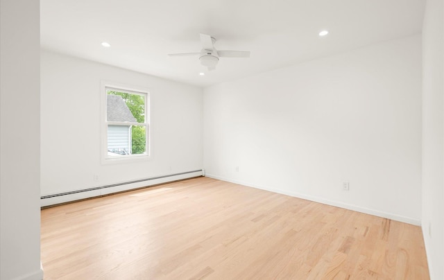 8 Maple St, Glenwood Landing, NY 11547 - spare room featuring a baseboard heating unit, wood finished floors, recessed lighting, a ceiling fan, and baseboards