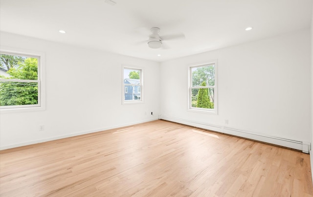 8 Maple St, Glenwood Landing, NY 11547 - unfurnished room featuring plenty of natural light, a baseboard heating unit, light wood-type flooring, a ceiling fan, and recessed lighting