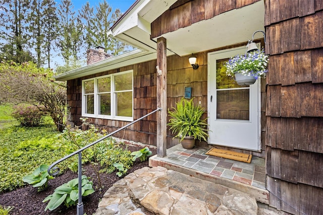 property entrance with a chimney