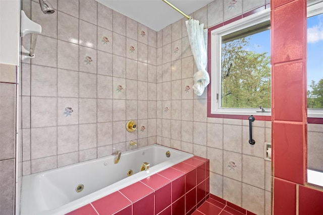 bathroom with tile walls, a jetted tub, tile patterned floors, and curtained shower