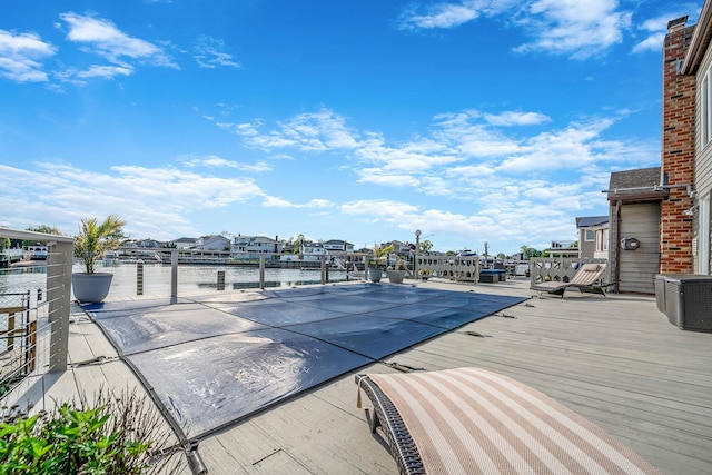 3452 Ocean Ave, Oceanside, NY 11572 - view of pool featuring a water view, central AC unit, a residential view, and a boat dock