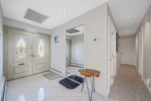 3452 Ocean Ave, Oceanside, NY 11572 - foyer with a baseboard radiator, light tile patterned flooring, baseboards, and recessed lighting