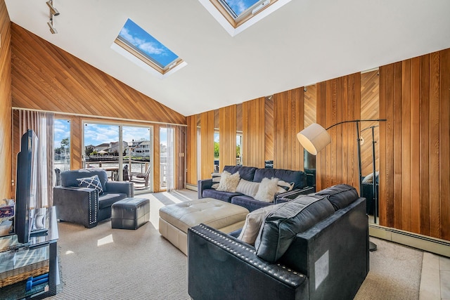 3452 Ocean Ave, Oceanside, NY 11572 - living room with wood walls, a skylight, baseboard heating, and high vaulted ceiling
