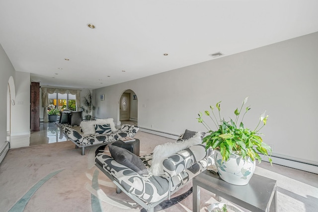 3452 Ocean Ave, Oceanside, NY 11572 - living room with arched walkways, baseboard heating, light colored carpet, baseboards, and recessed lighting