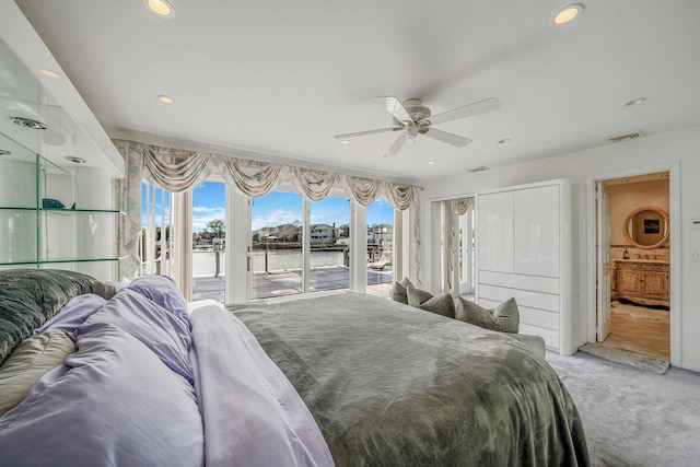 3452 Ocean Ave, Oceanside, NY 11572 - bedroom featuring access to exterior, a water view, light carpet, recessed lighting, and a ceiling fan