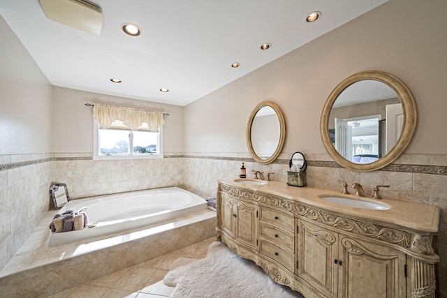 3452 Ocean Ave, Oceanside, NY 11572 - bathroom with a garden tub, tile patterned floors, recessed lighting, double vanity, and tile walls