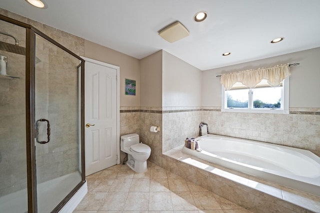 3452 Ocean Ave, Oceanside, NY 11572 - full bathroom featuring a garden tub, a stall shower, toilet, recessed lighting, and wainscoting