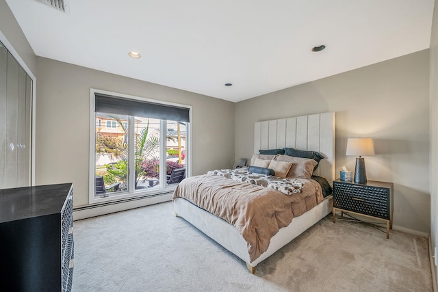 3452 Ocean Ave, Oceanside, NY 11572 - bedroom with baseboard heating, light colored carpet, recessed lighting, and baseboards